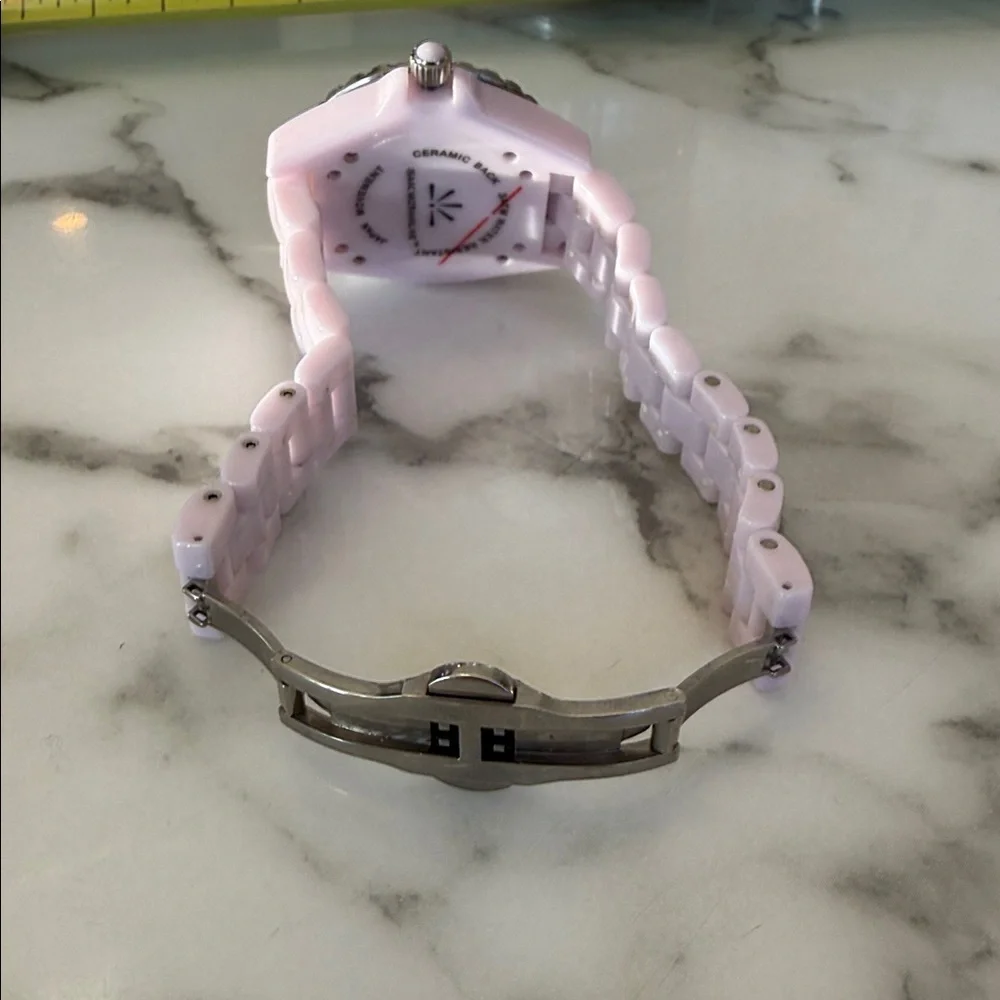 Isaac Mizrahi Live women’s pink sport watch with bracelet style band